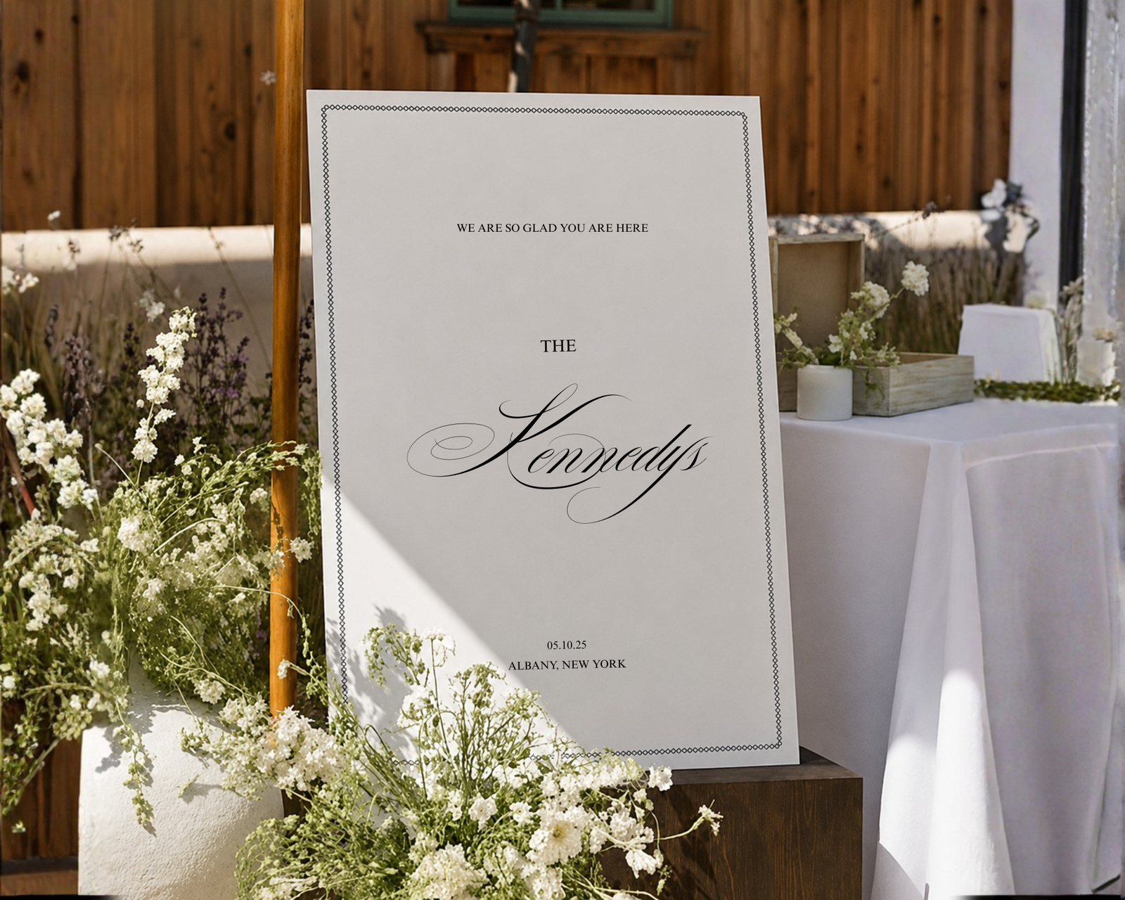 Acrylic new last name wedding sign displayed behind a reception bar