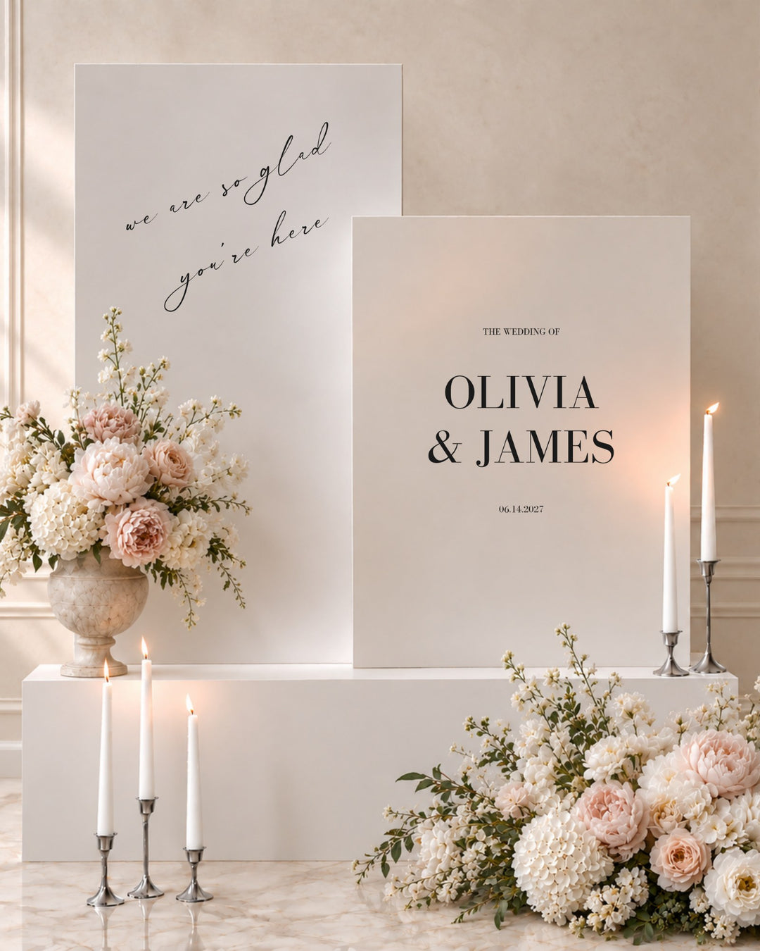 Aria acrylic double wedding welcome signs on white plinths with taper candles and blush florals
