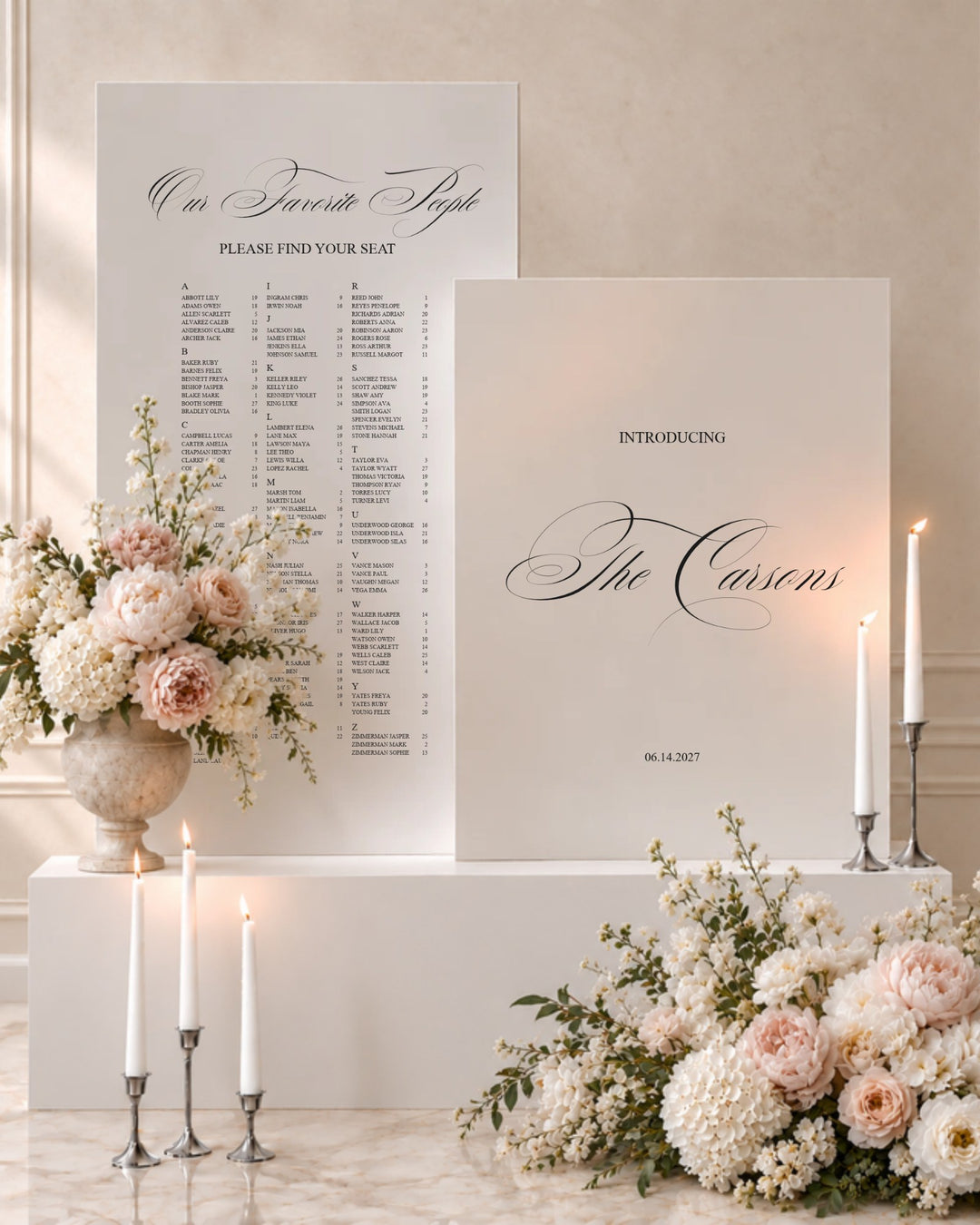 Florence acrylic wedding welcome sign and seating chart pair on white plinths with taper candles and blush florals