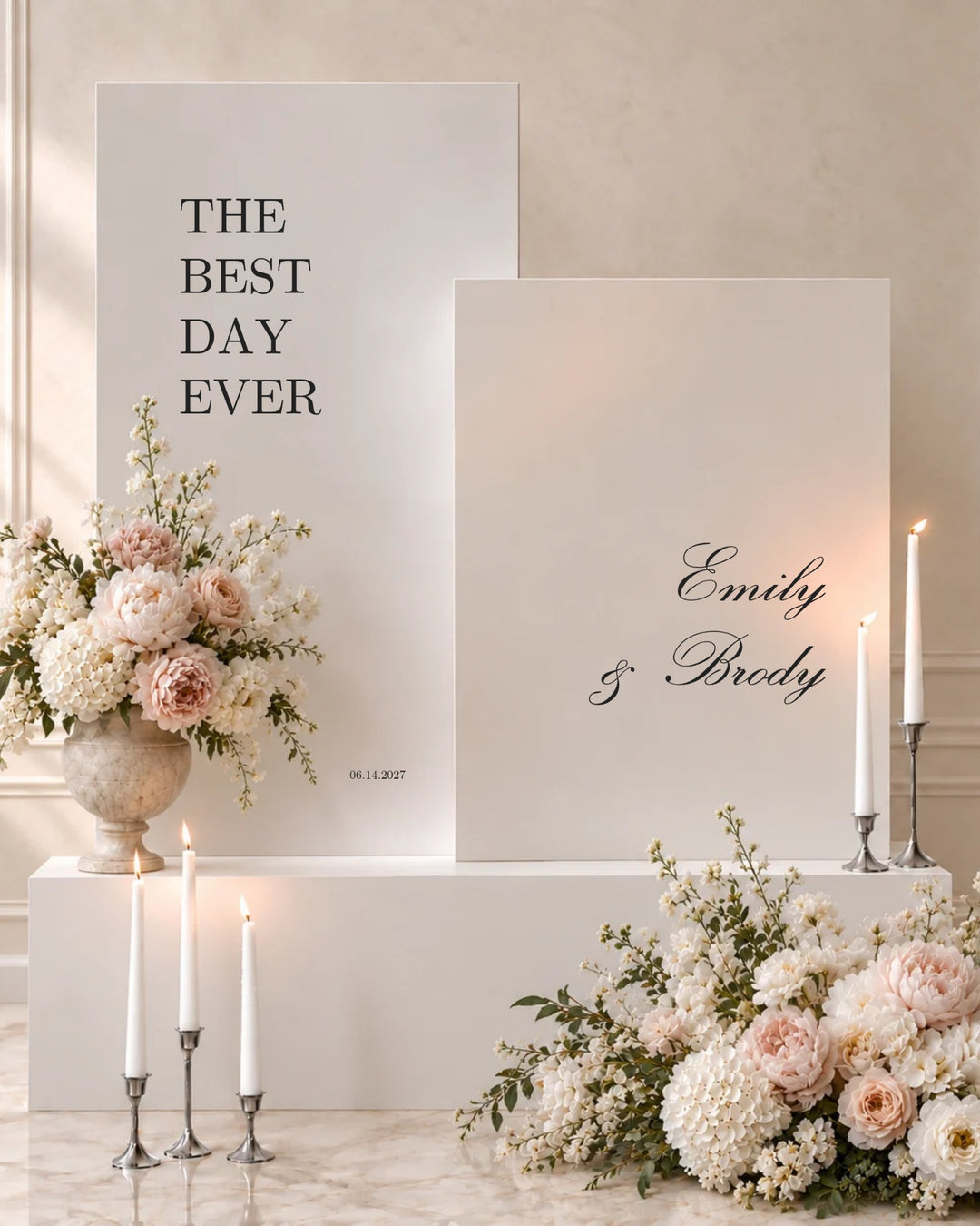 Reina acrylic double wedding welcome signs on white plinths with taper candles and blush florals