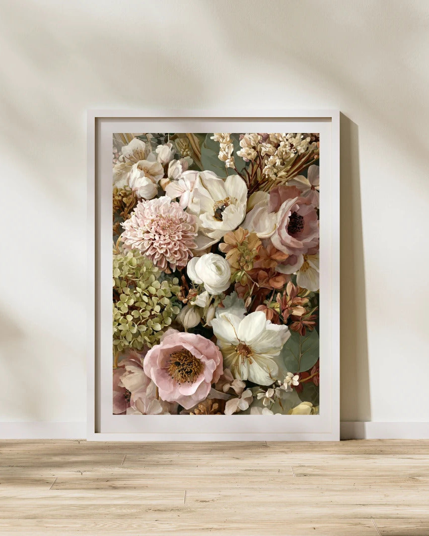 A floral painting printed as a poster in a white frame, leaning against a sunlit wall